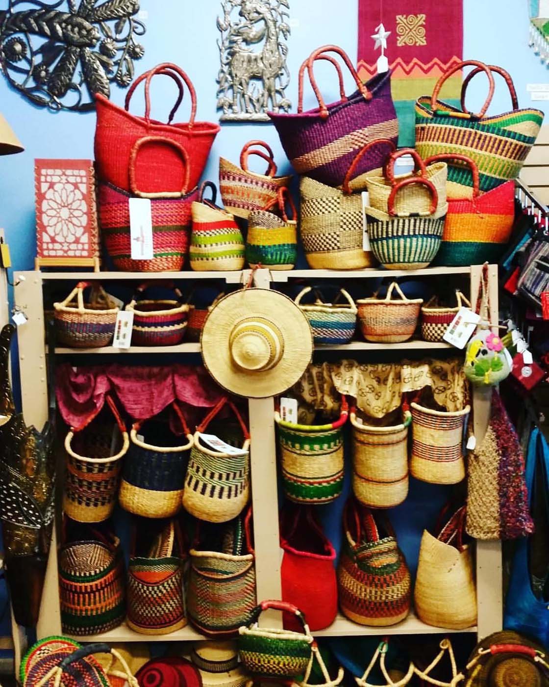 Simple store shelves are brightened by Bolga baskets