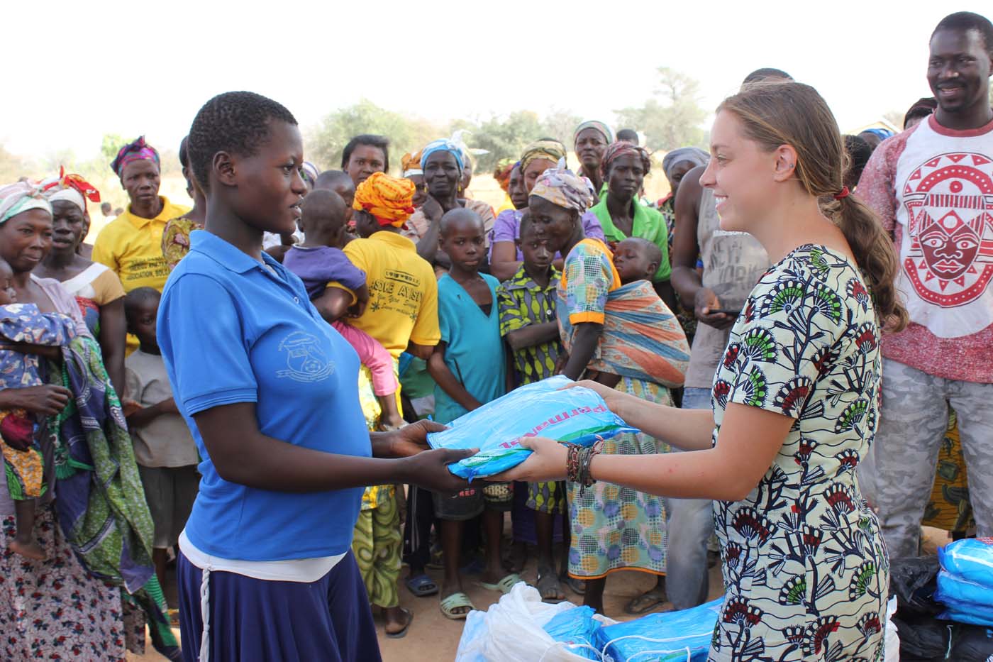 Our Peace Corps volunteer handing out a mosquito net