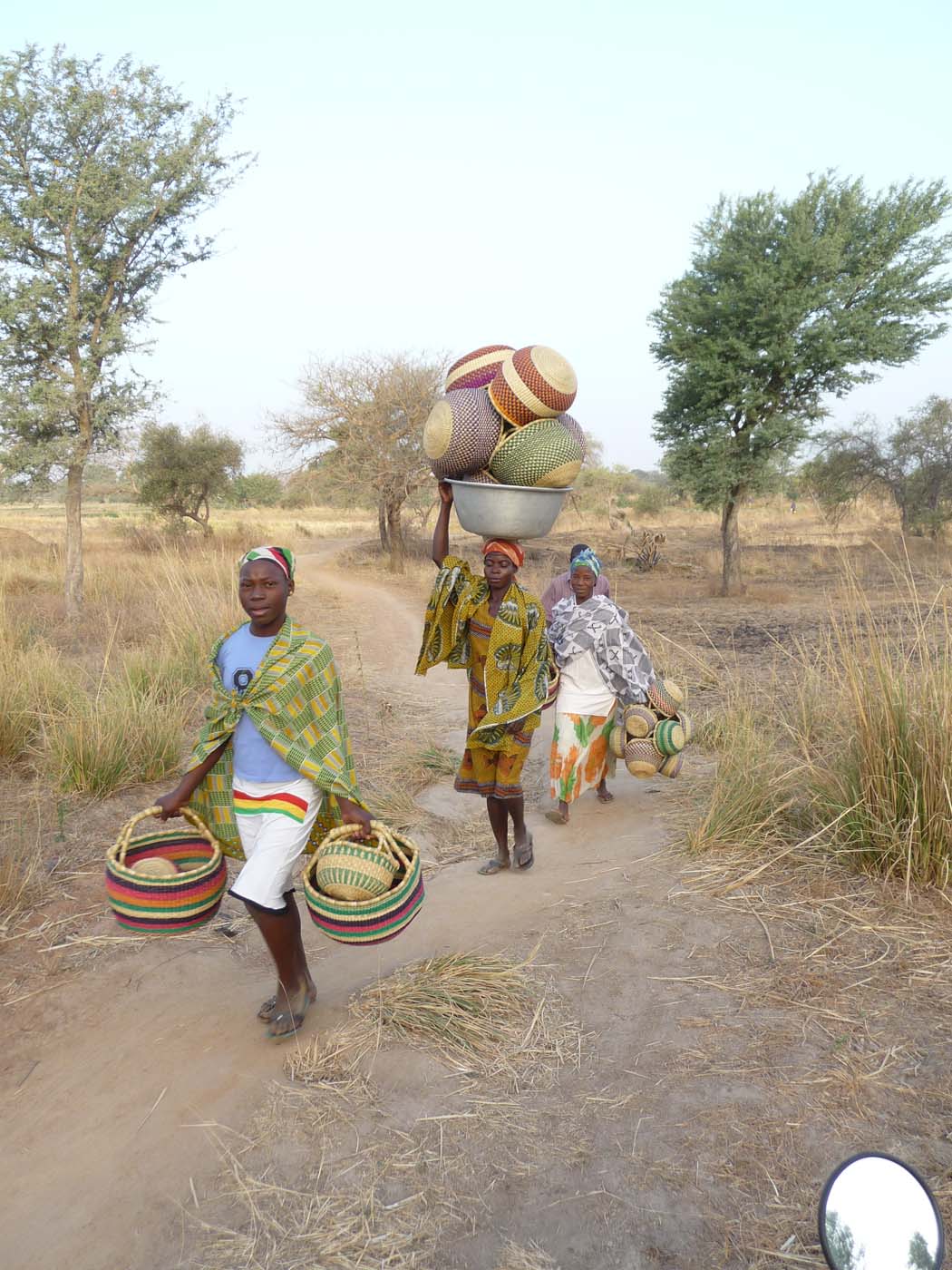Women often carry baskets for other women in the village